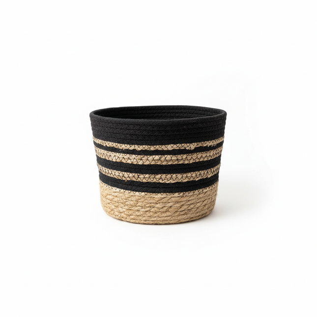 Single handwoven storage basket with natural jute base and black white striped pattern