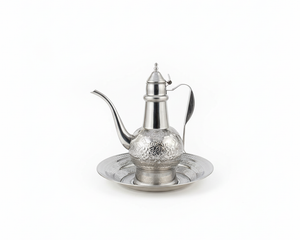 Traditional Arabic coffee pot dallah with ornate engraved design on matching tray