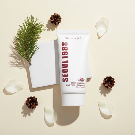 K-Secret Seoul 1988 Sun lifestyle flat lay with pine botanicals