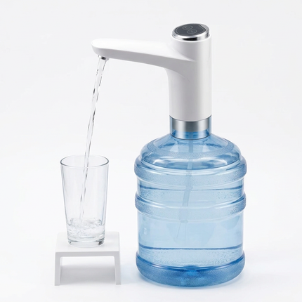 Pump fitted to a large water bottle, dispensing into a glass